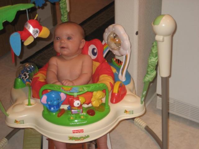 My boy in his bouncer: Just thought I'd post a pic for a baby update.  The little man is lovin his bouncer, and is 2 1/2 months old now :).